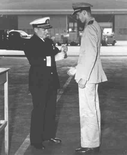 Commodore Gordon Rowe Presents Medal to Lt Lee L. (Ham) Hamrick
